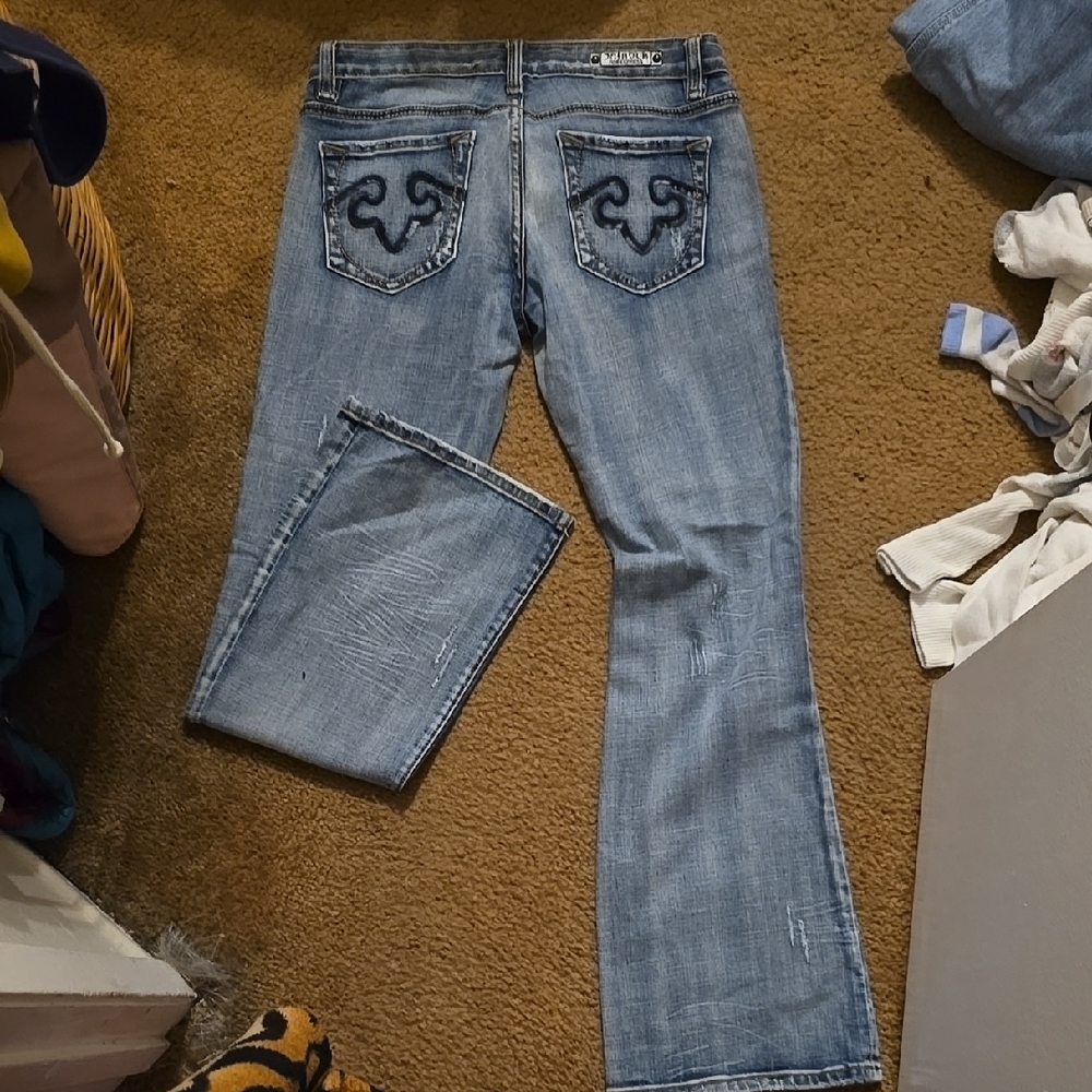Light Blue Boot Cut Jeans with Faded Design and Decorative Stitching